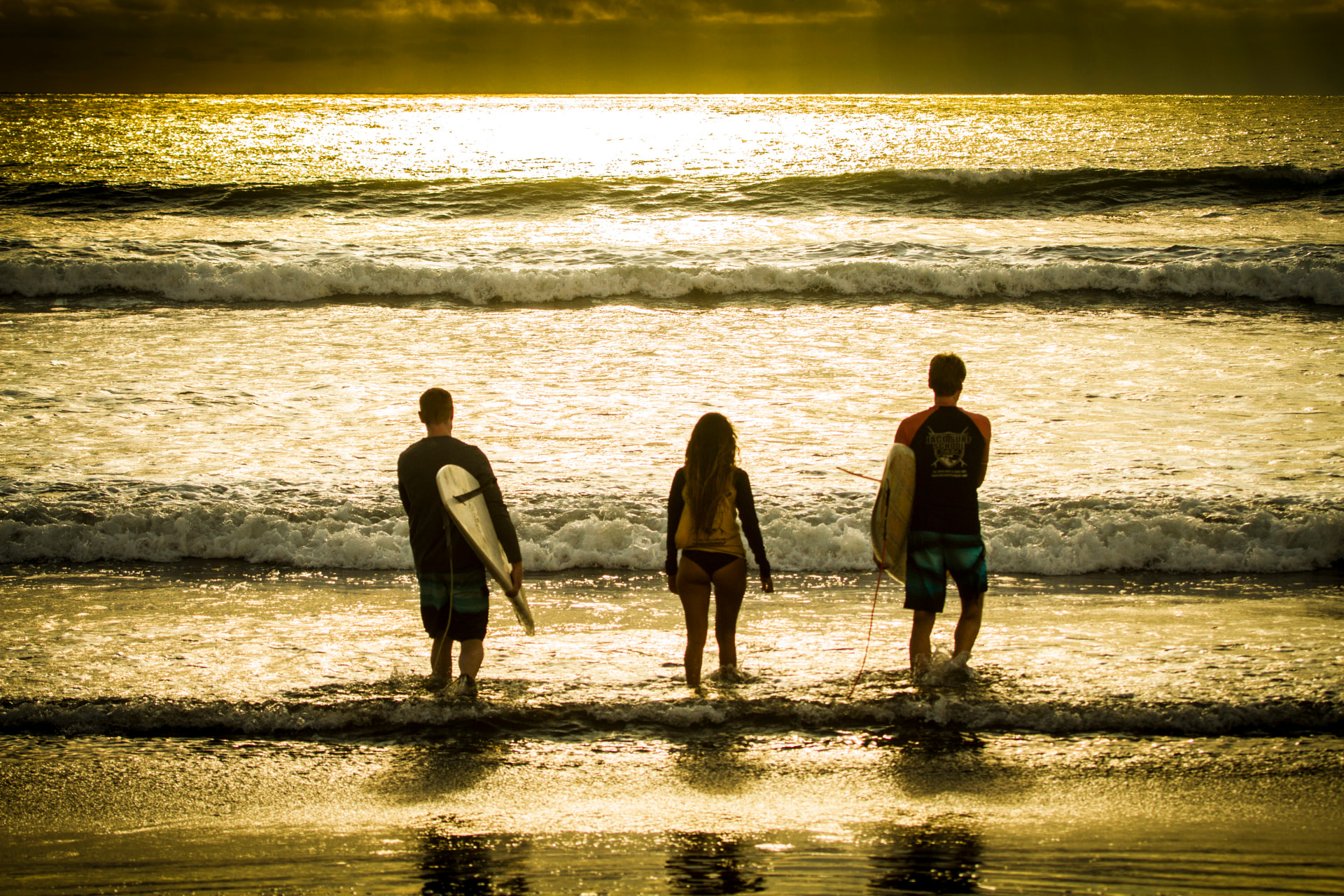 Surfers at sunset
